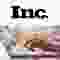 A logo reading "Inc." in black on white, above hands typing on a laptop keyboard.