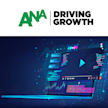 Computer on blue background with ANA logo on top
